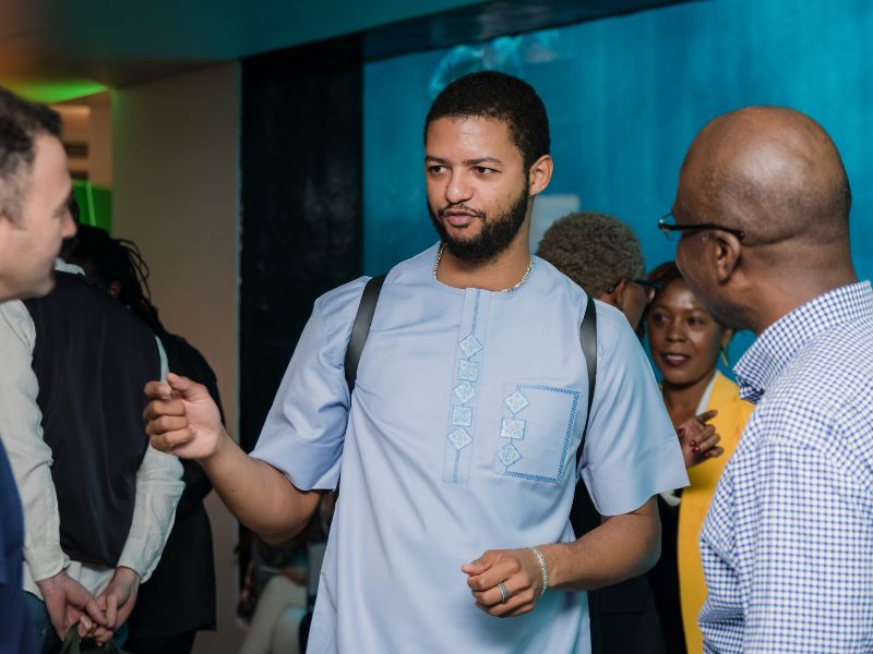 Two men standing and having a conversation.